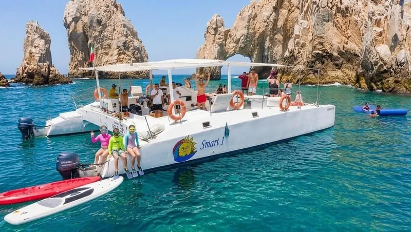 Snorkelers over a reef in Santa María Bay on a catamaran snorkeling in Cabo San Lucas tour